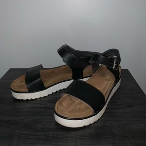 Black strap sandals with brown footbed